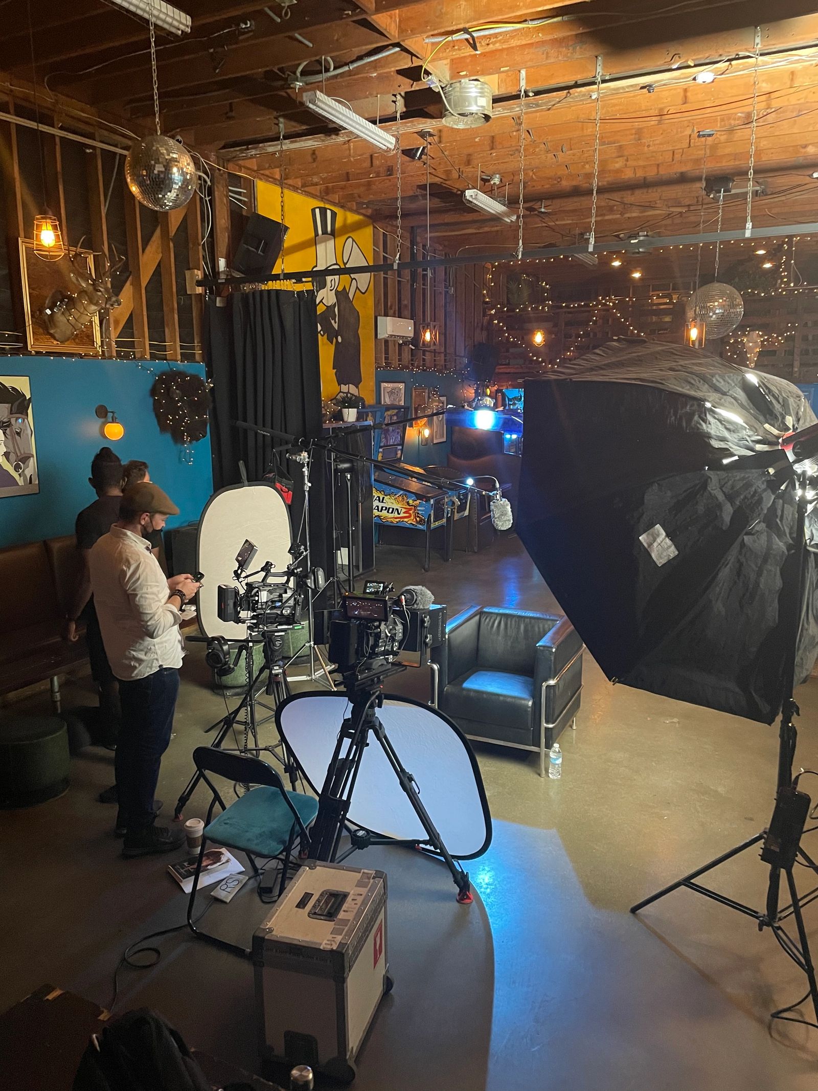 Camera, reflector and large lighting softbox during a production at our Chinatown space